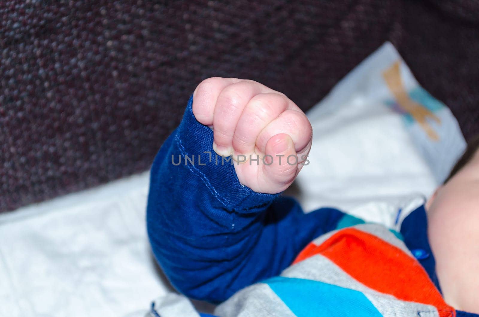 Close-up,baby hand clenched to fist.