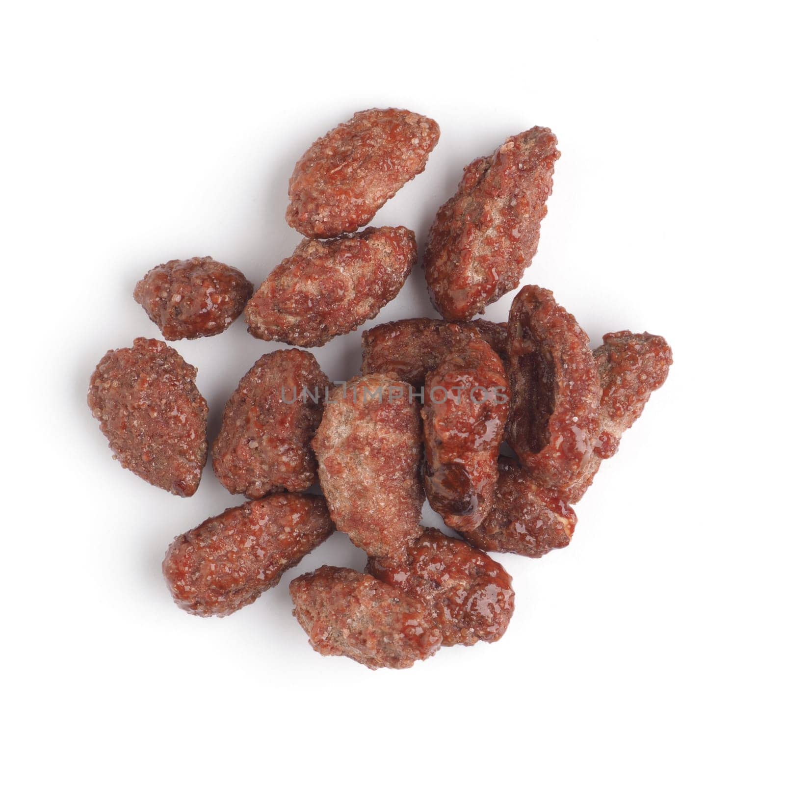 Tasty roasted almonds on a white background, seasonal sweet food, Christmas snacks