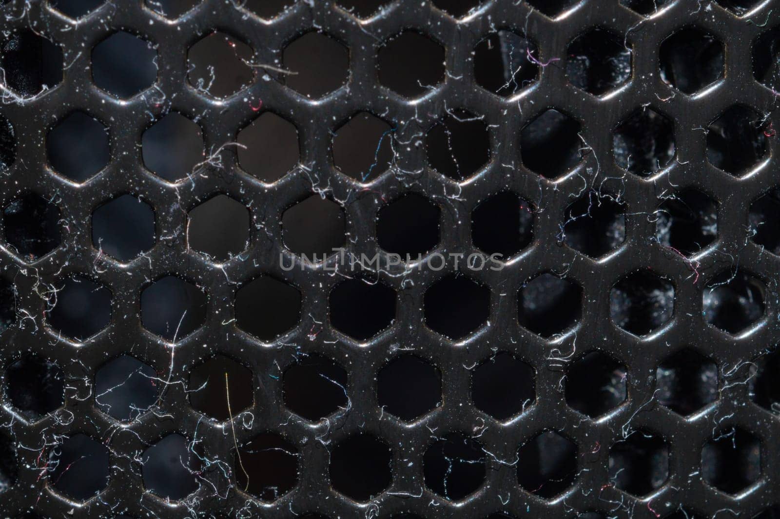 Dusty ventilation grid with round holes macro