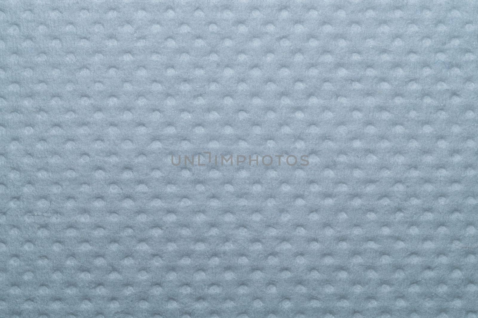 White dotted paper macro. background. napkin surface close up