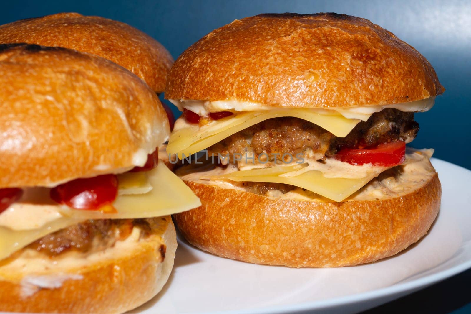 Homemade cheeseburger close up. beef meat with tomato and cheese