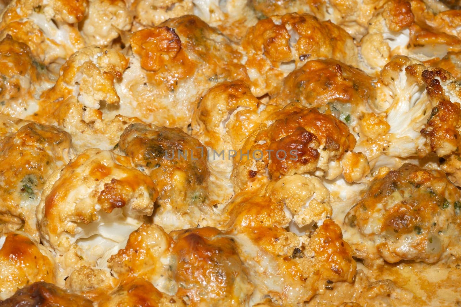 Baked cauliflower with cheese close up