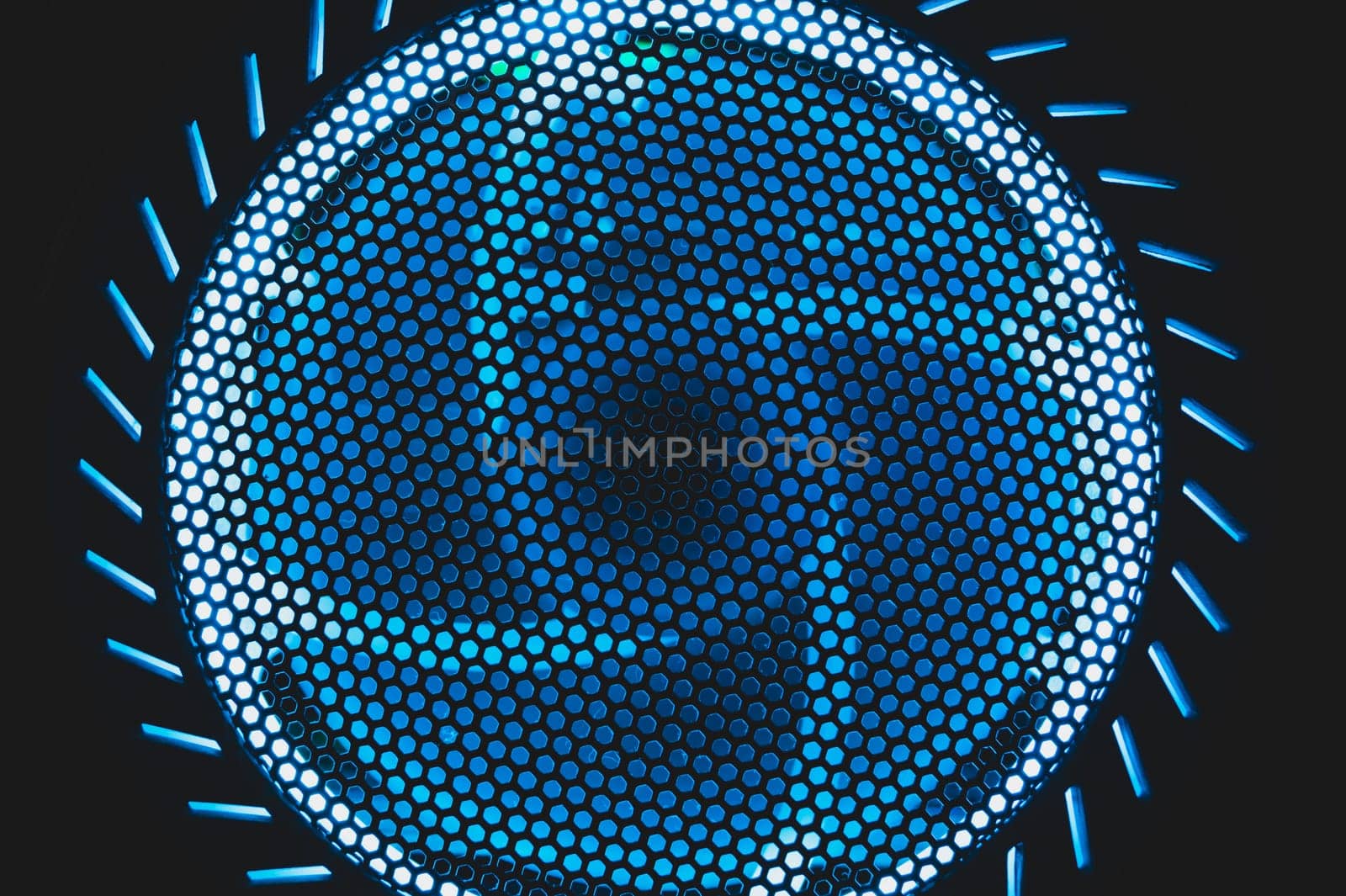 PC cooler fan with blue led lights illumination in the dark. abstract futuristic background