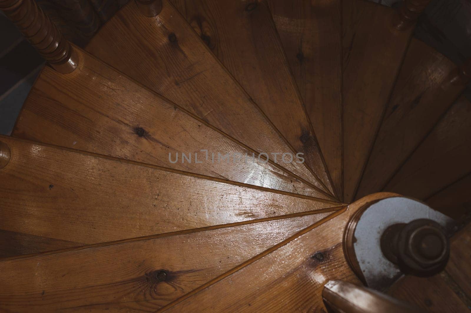 Spiral wooden stairway in country house. homemade interior