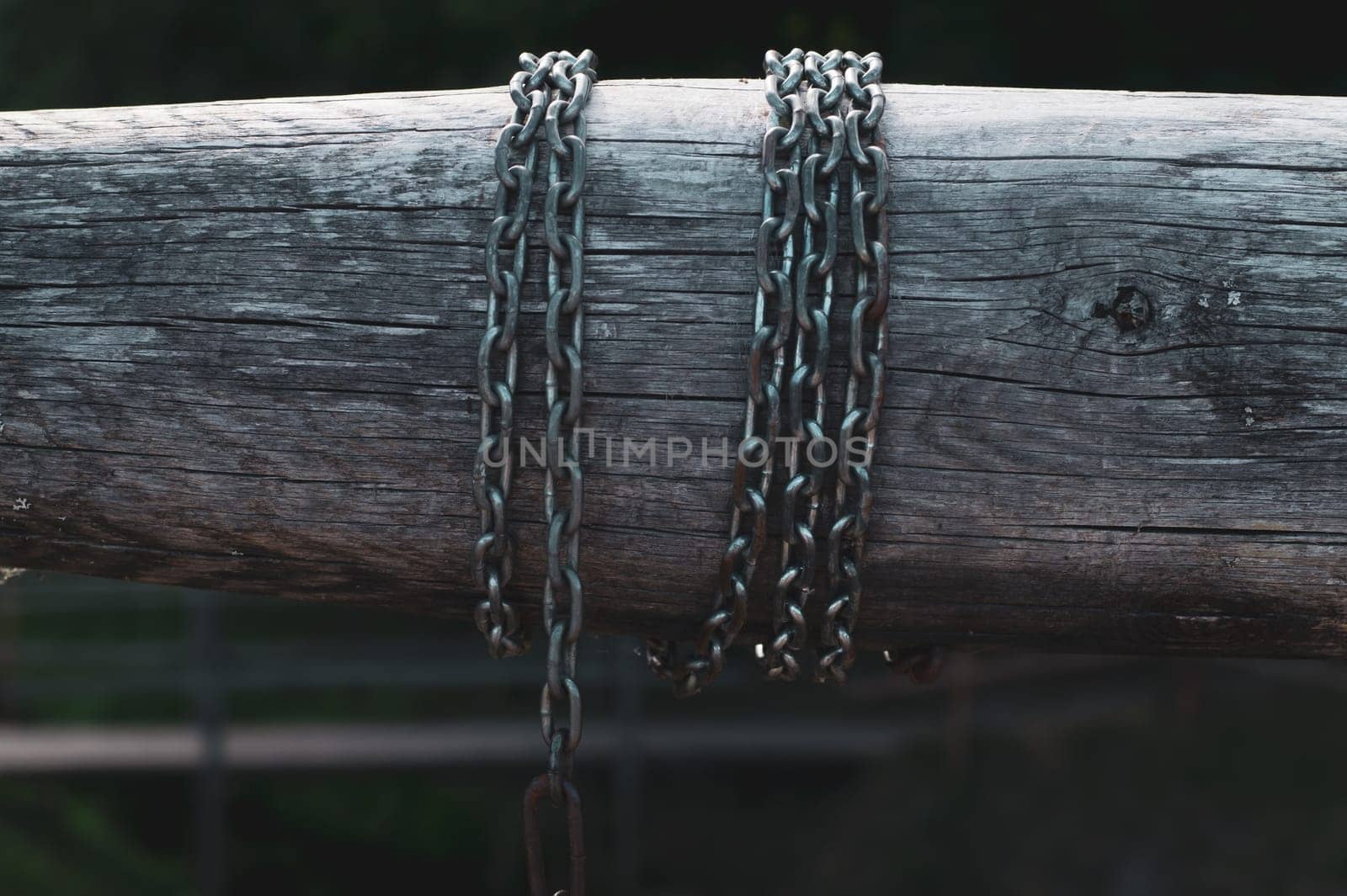 Detail of wooden winch with chain. part of mechanism of water from the well