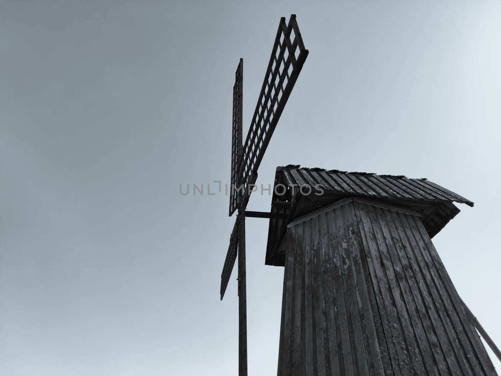 Old wooden windmill. rural building. black and white
