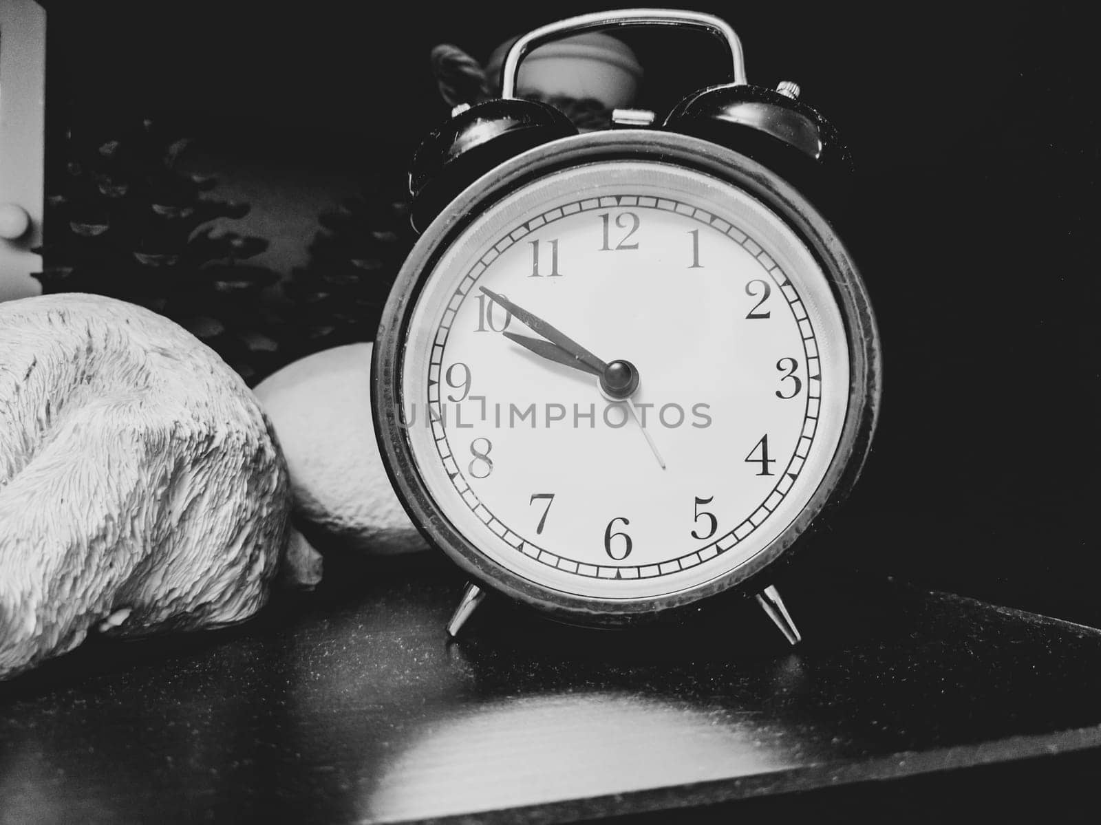 Retro black round alarm clock close up