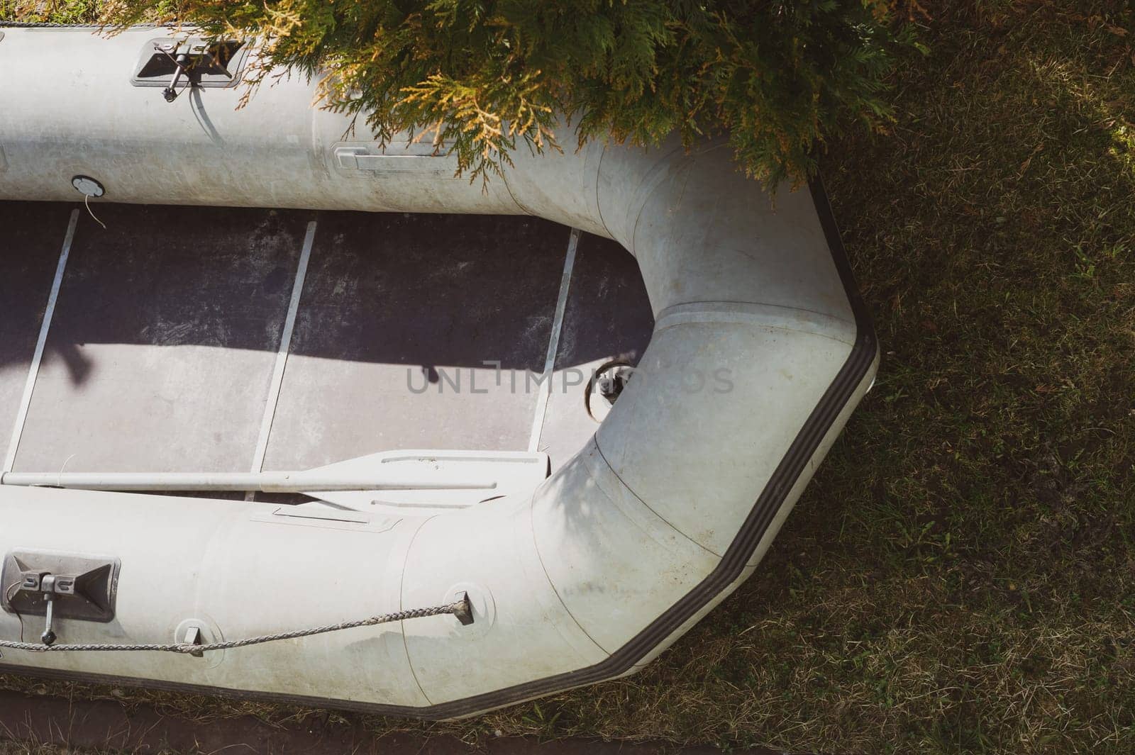 Inflatable boat on the green grass