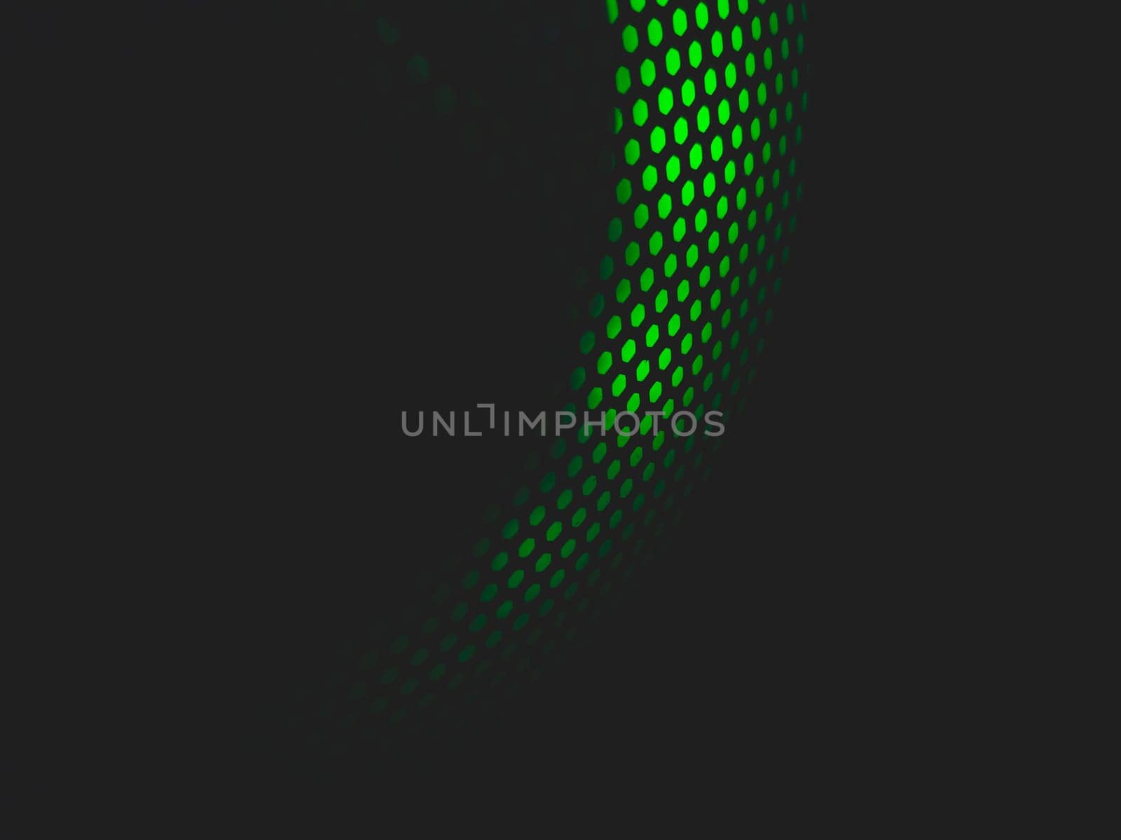 Modern abstract background with green lights. cooler of processor with neon light luminous through the protective grid in the dark