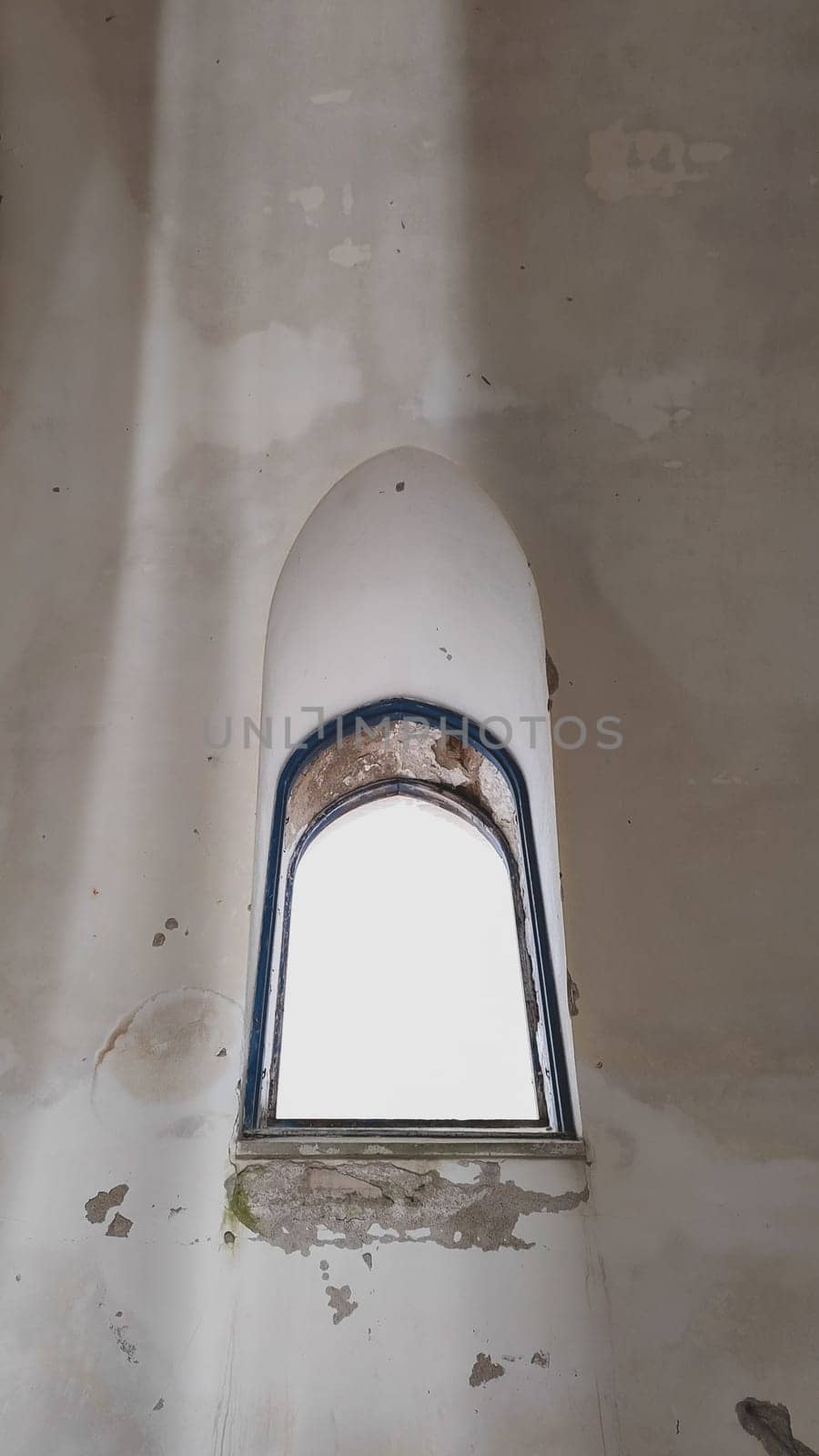 Window of abandoned church. copy space in the middle
