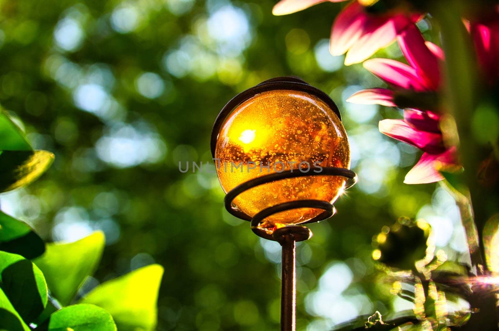 yellow glass ball in the sunlight on the balcony. sometimes the beautiful things are so near