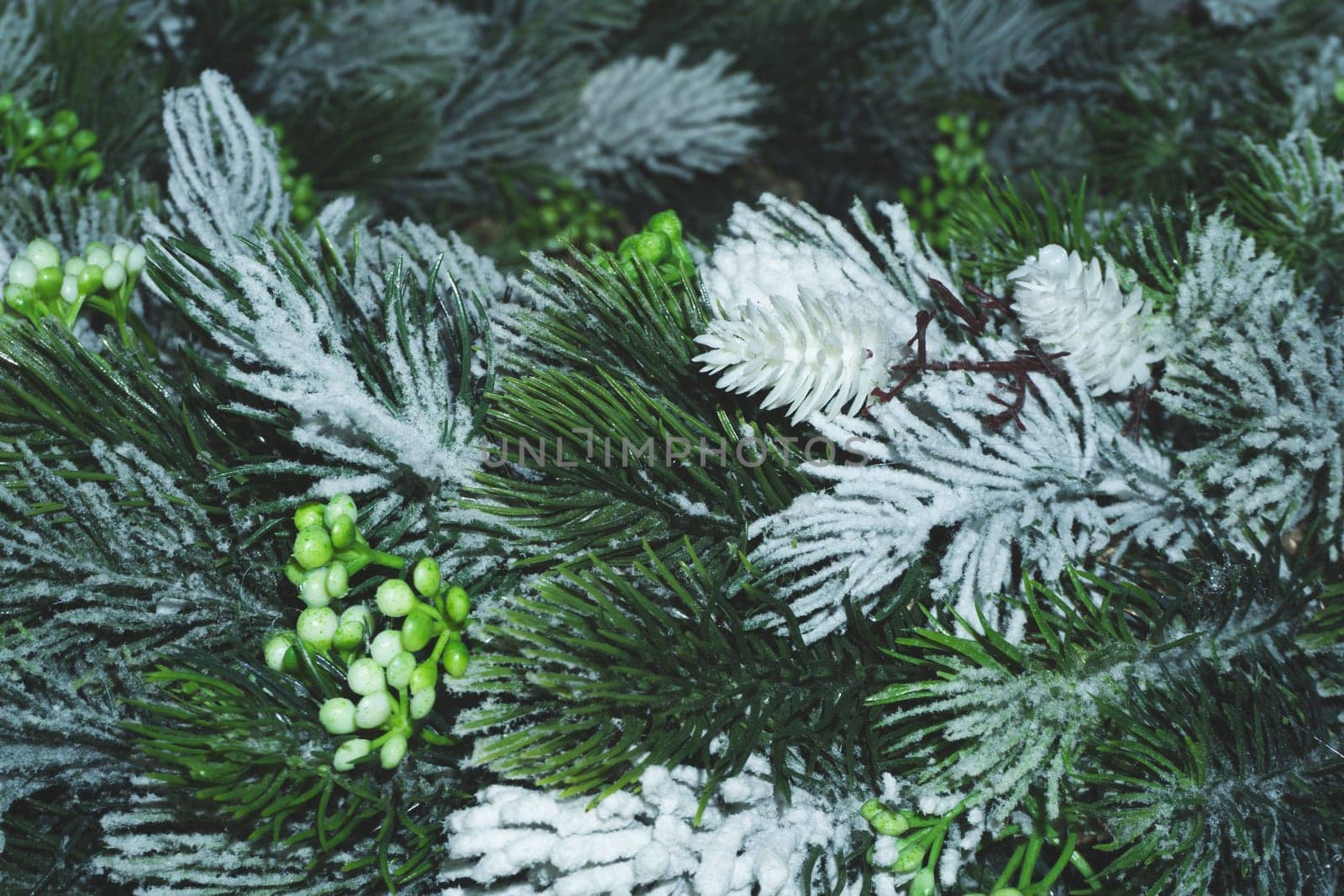 Artificial fir tree branches with needles close up. Christmas decoration