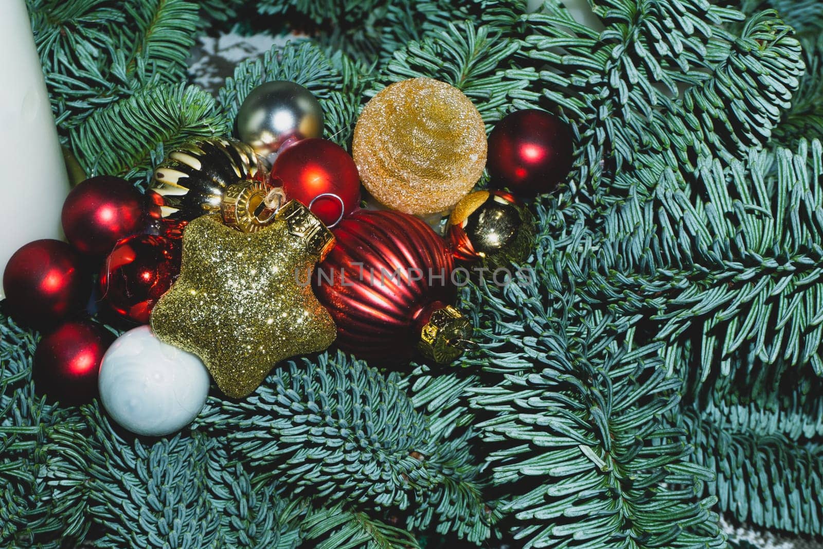Artificial fir tree branches with Christmas tree toys