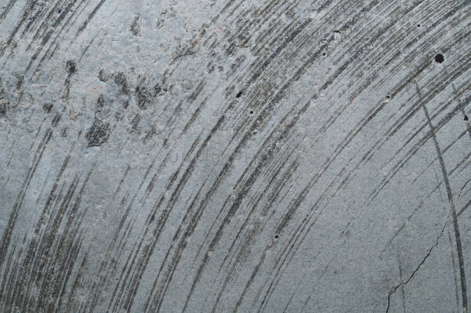 Concrete wall with cracks and scratches. abstract gray background with patterns. wall is ready for renovation works