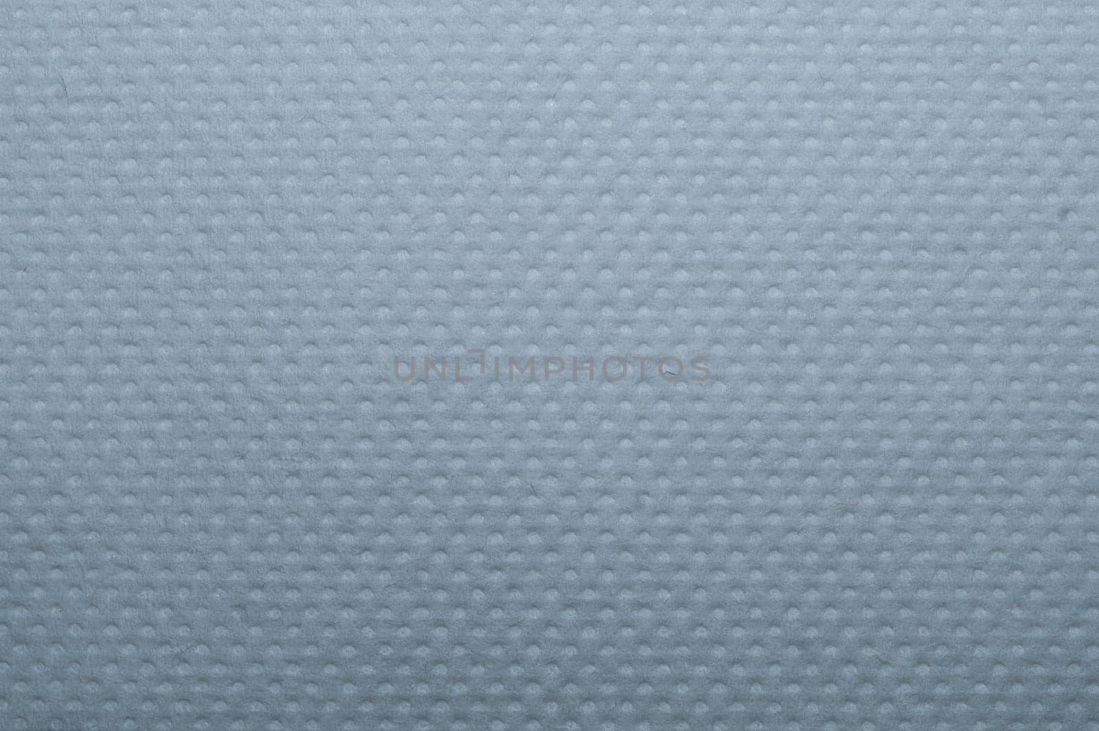 White dotted paper macro. background. napkin surface close up