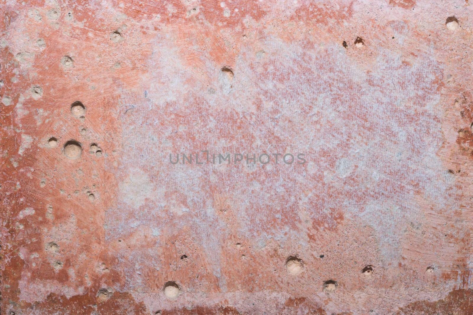 Old brown stone wall. aged concrete background. rough shabby cement backdrop