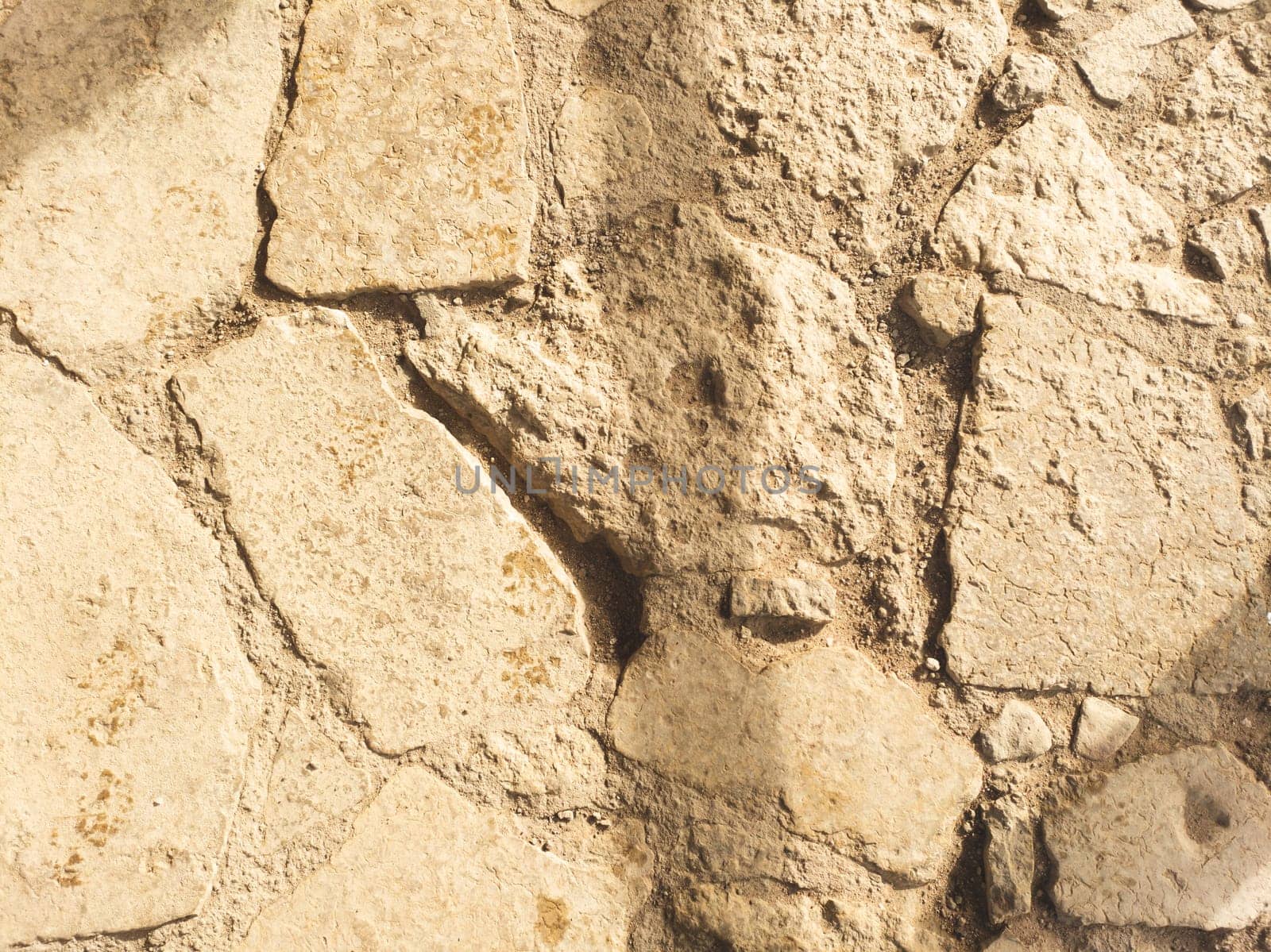 Ancient pavement stone background close up. old cobblestone backdrop