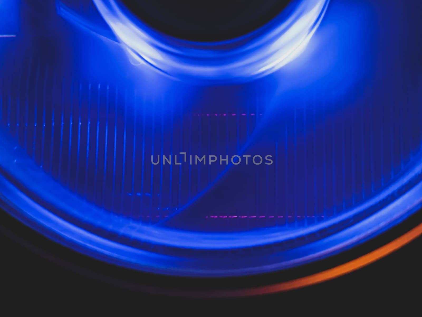 Computer cooling fan with blue light abstract background. cooler in action with led close up. power in motion concept