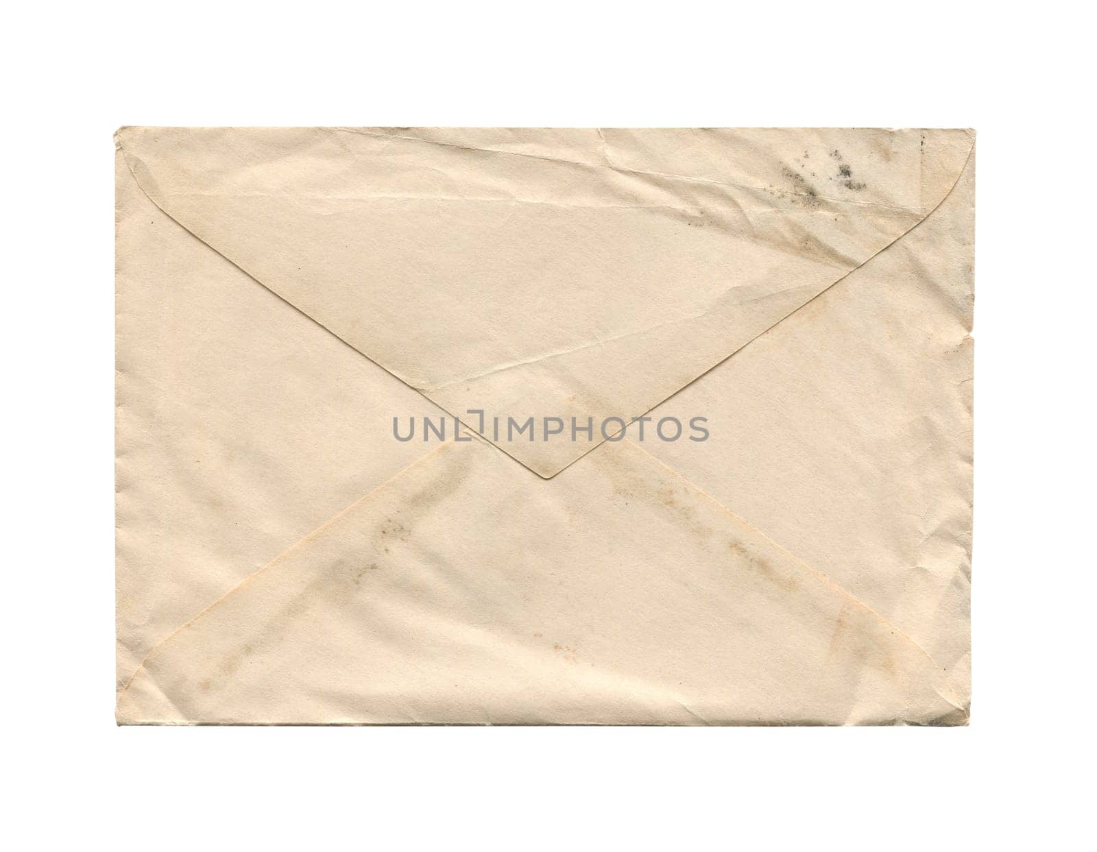 front view closeup of blank old aged vintage closed letter paper postage envelope with torn edges and wrinkled grunge texture isolated on white background
