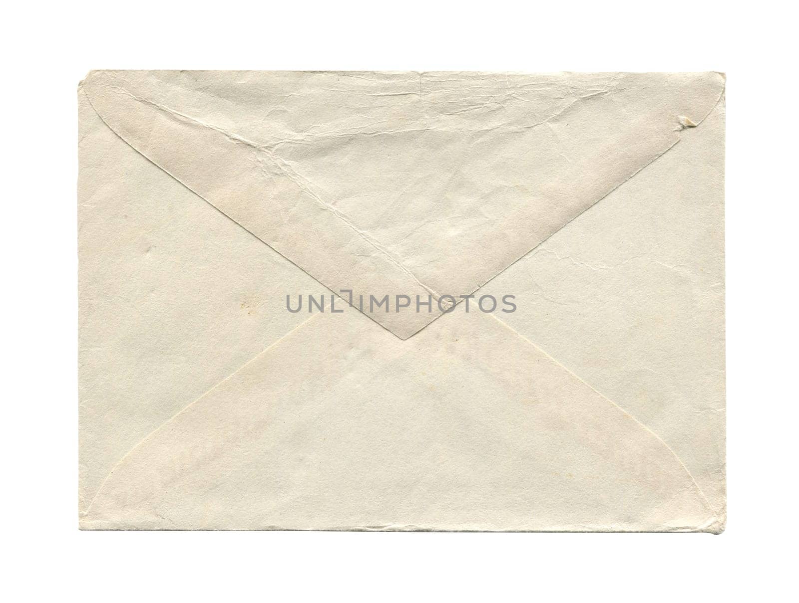 front view closeup of blank old aged vintage closed letter paper postage envelope with torn edges and wrinkled grunge texture isolated on white background