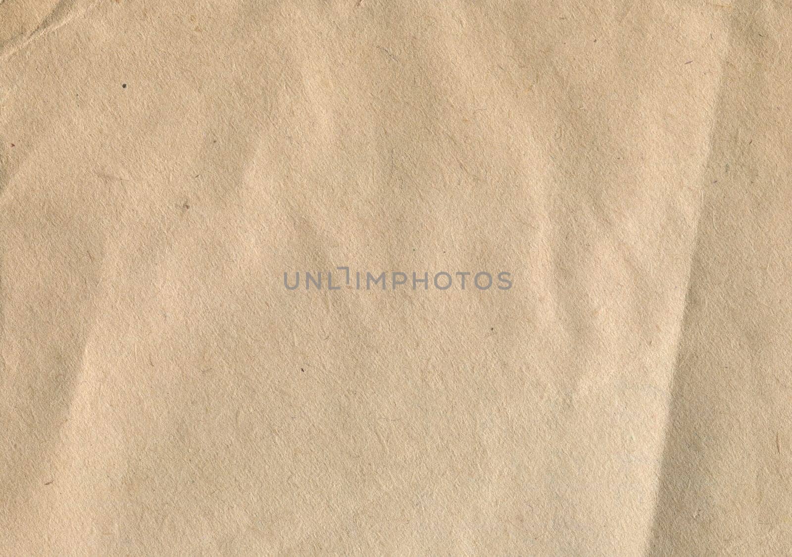 front view closeup of vintage brown craft paper texture pattern background with wrinkles and imperfections