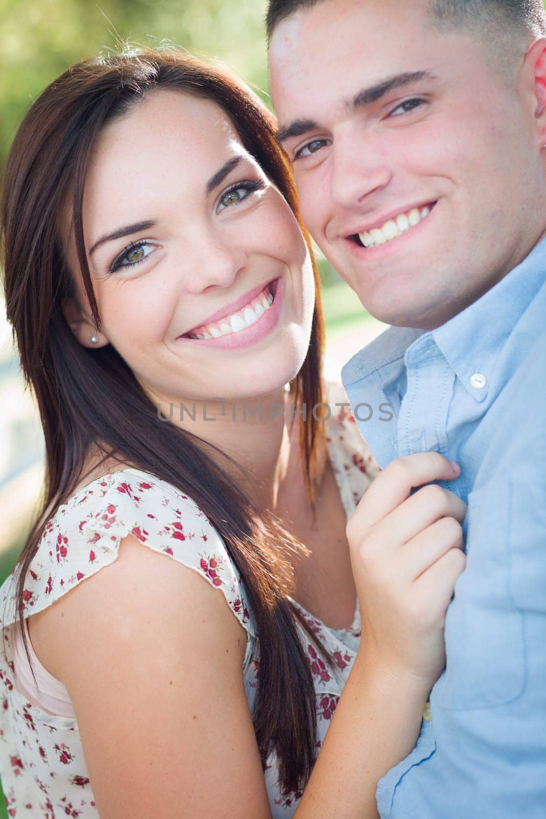 Happy Romantic Caucasian Couple Portrait in the Park.