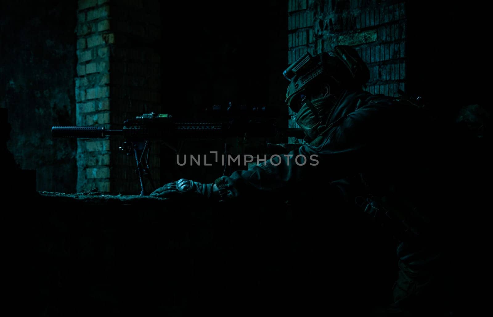 Marksman in action in the ruined city under cover of darkness