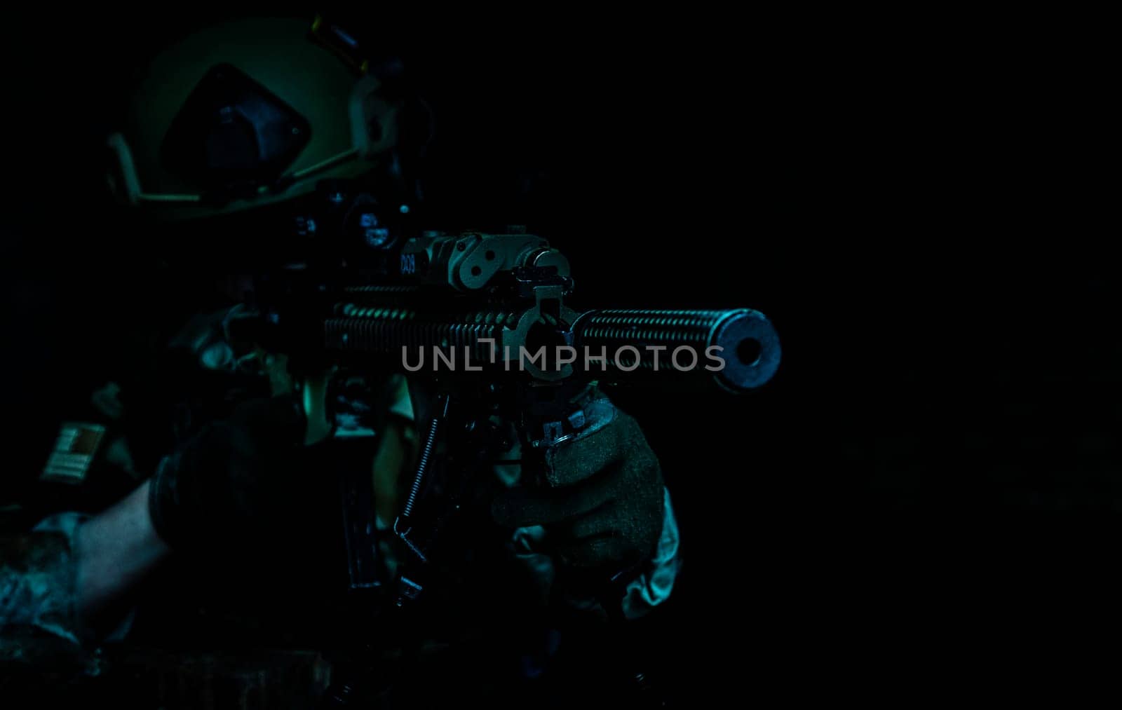 Marksman in action in the ruined city under cover of darkness