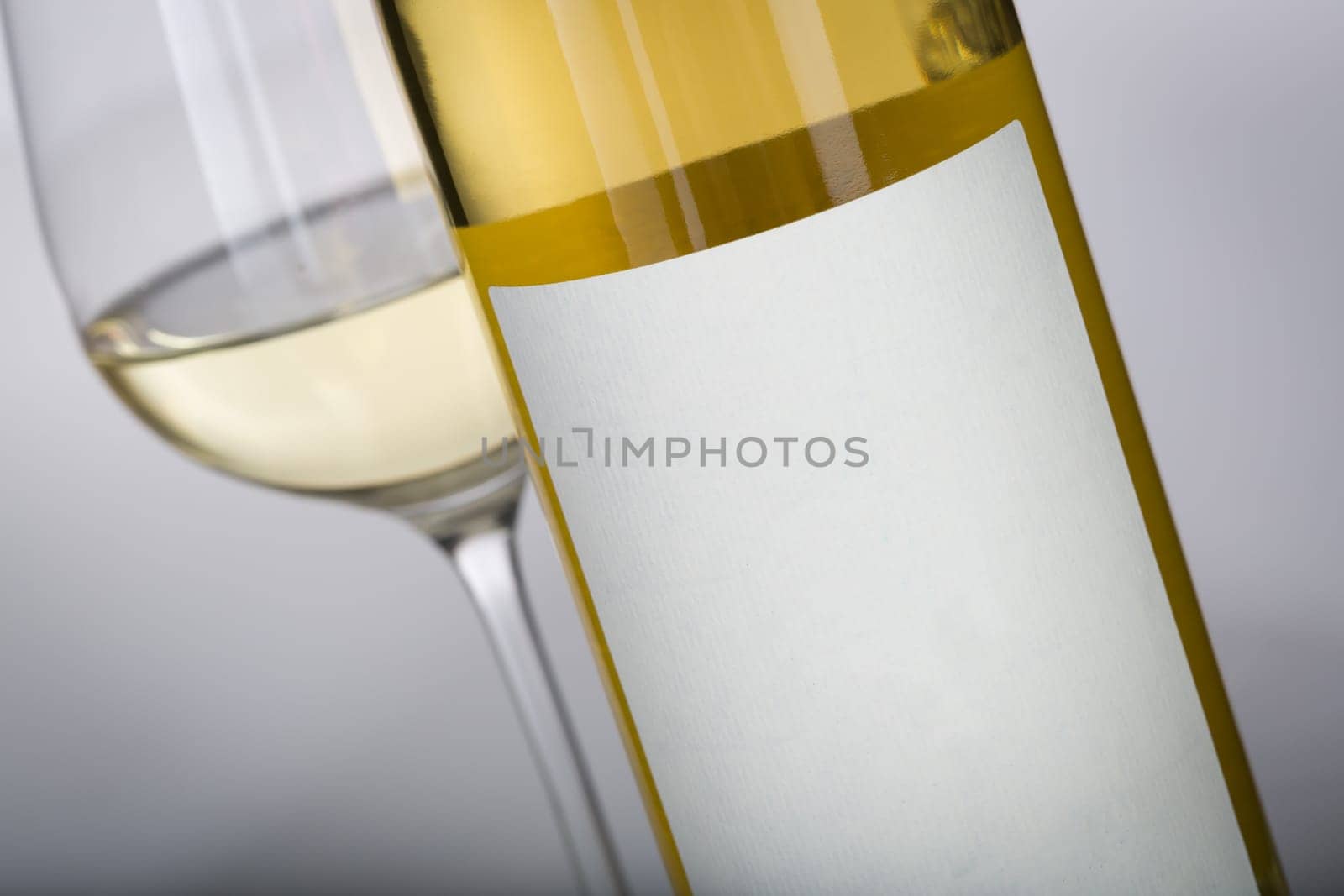 Wine Glass and Bottle with Blank Label Ready For Graphic and Text.