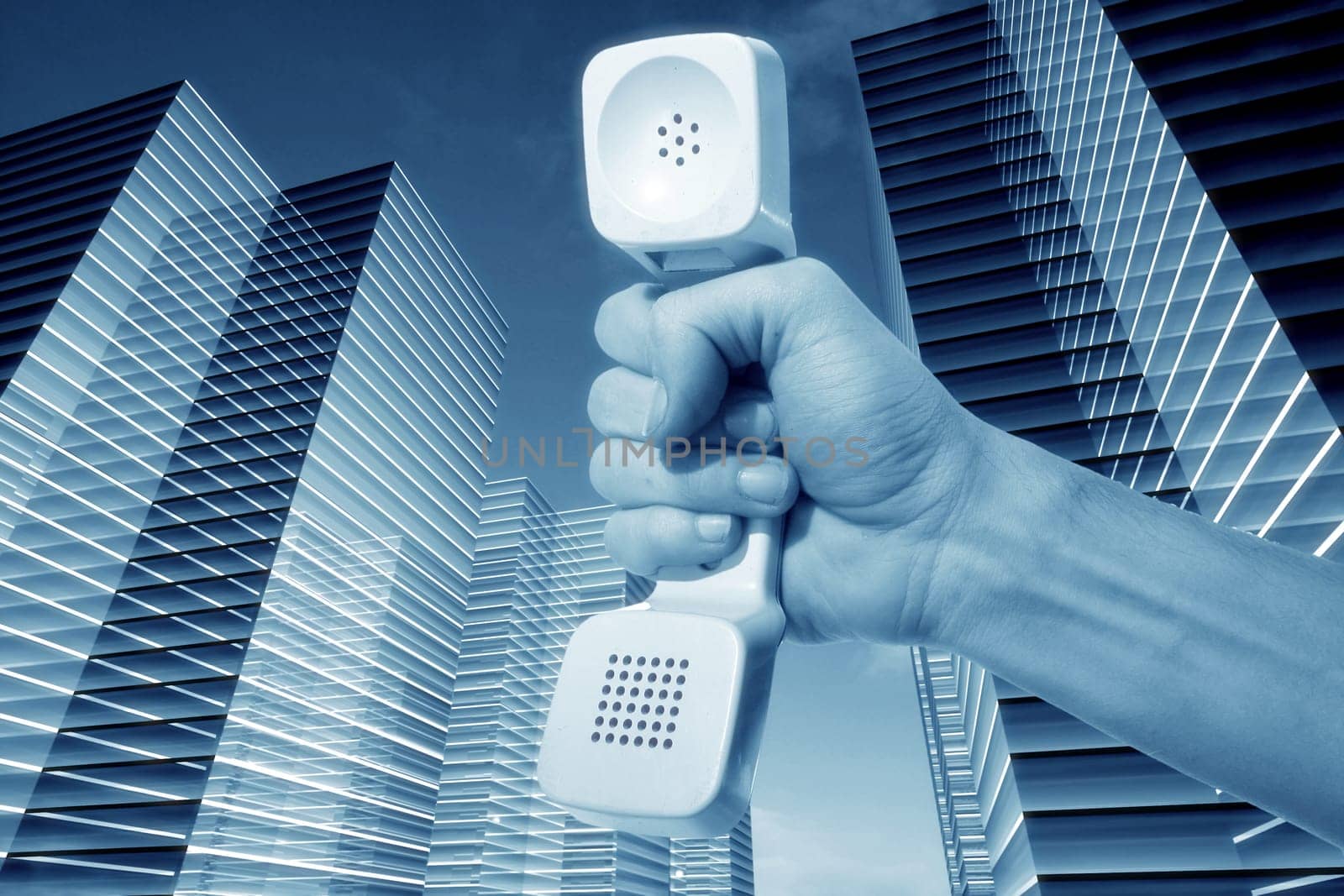 hand and phone in skyscrapers connection concept