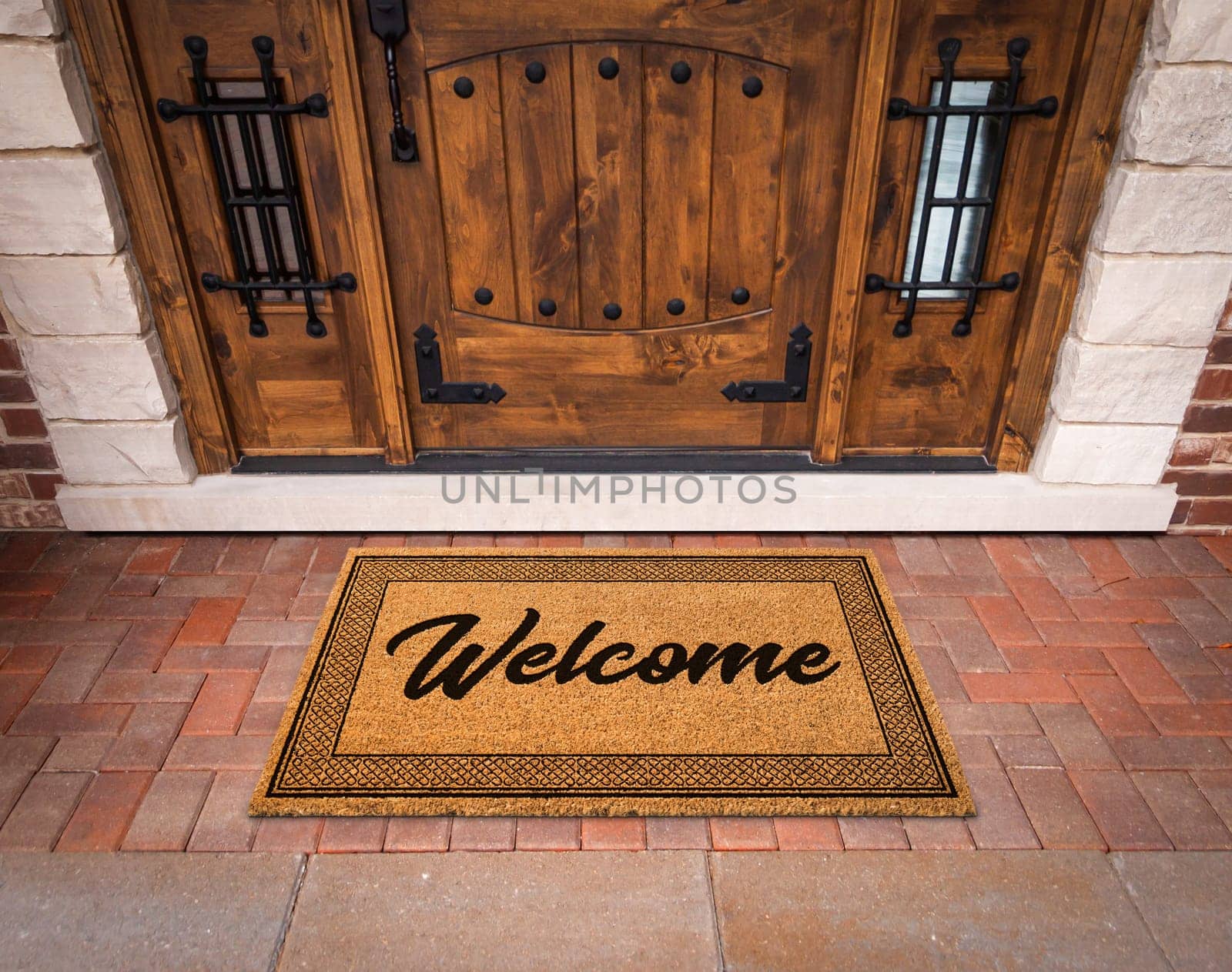 Welcome Mat At Custom Front Door Of House.