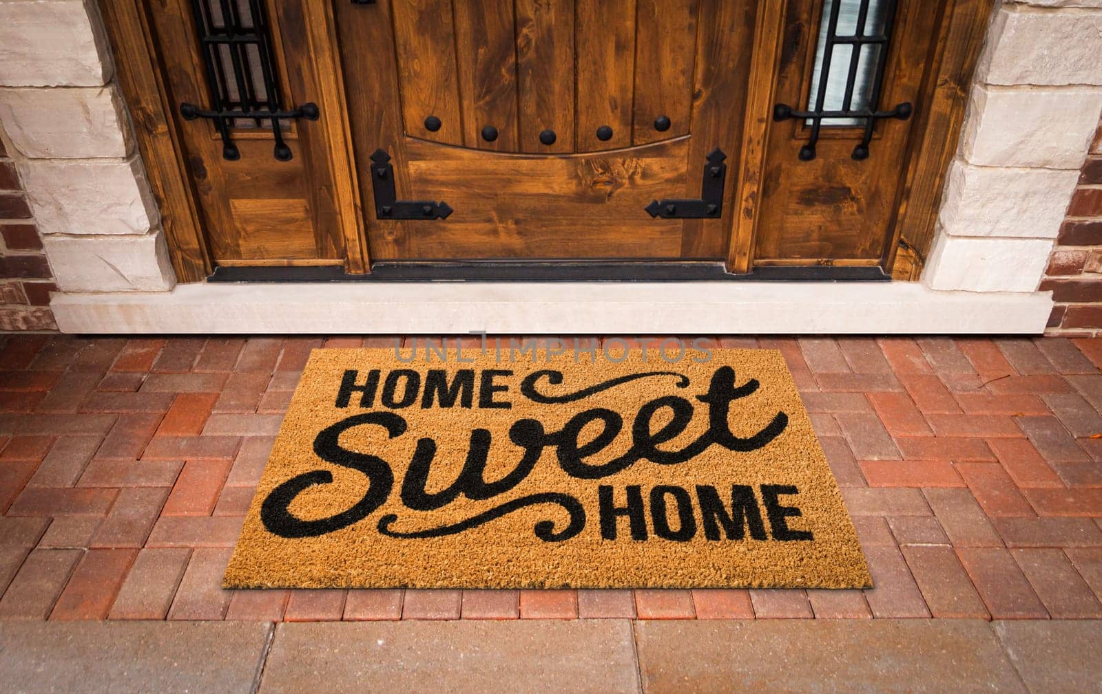 Home Sweet Home Welcome Mat At Custom Front Door of House.