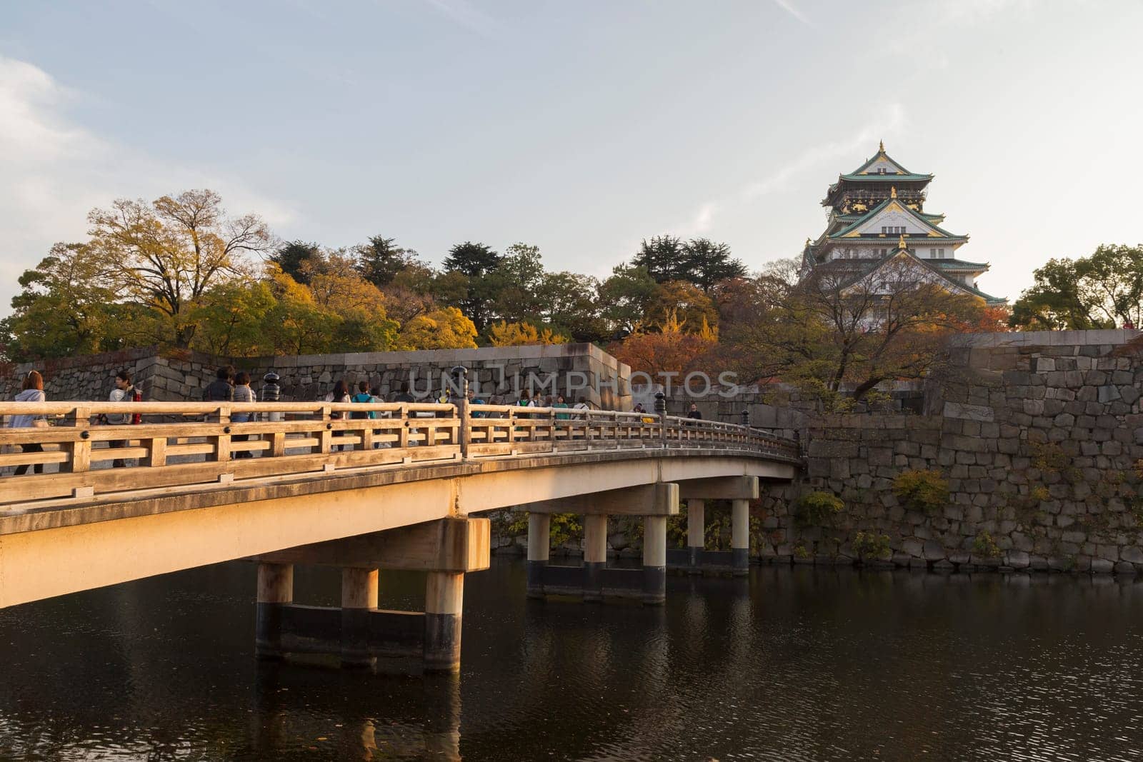 This photo was shot from Osaka Castle, Japan in the evening. The soft sunlight touch the castle is so beautiful.