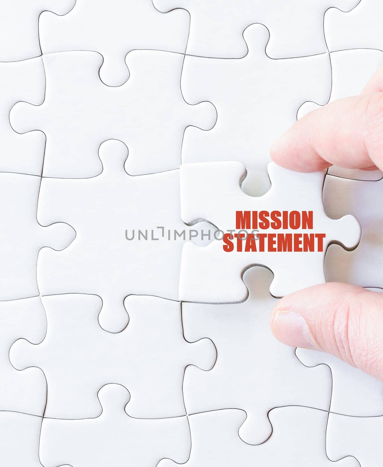 Last puzzle piece with words MISSION STATEMENT. Concept image