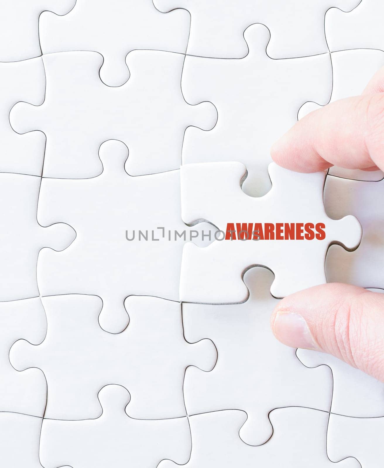Last puzzle piece with word AWARENESS. Concept image