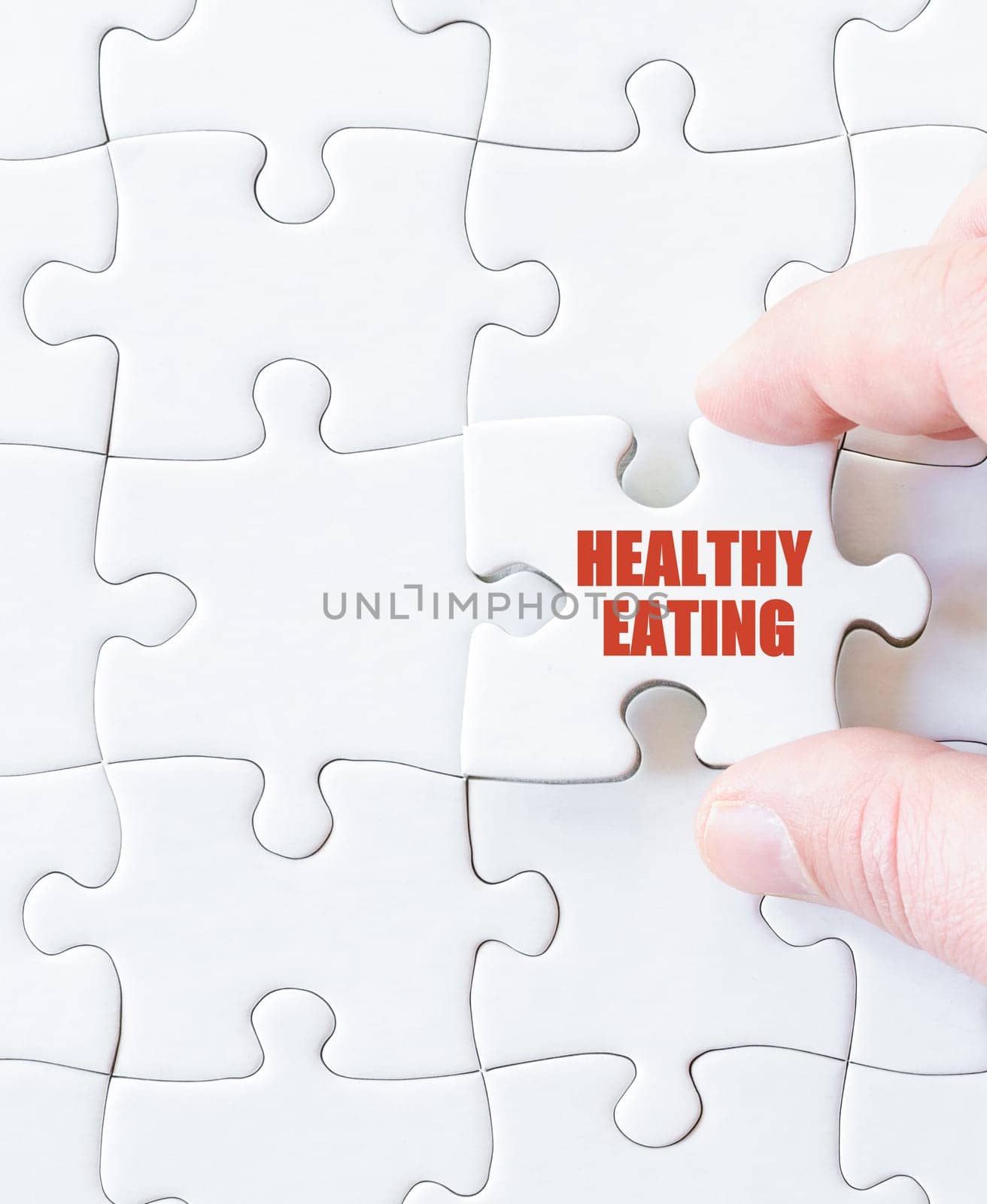 Last puzzle piece with words HEALTHY EATING. Concept image