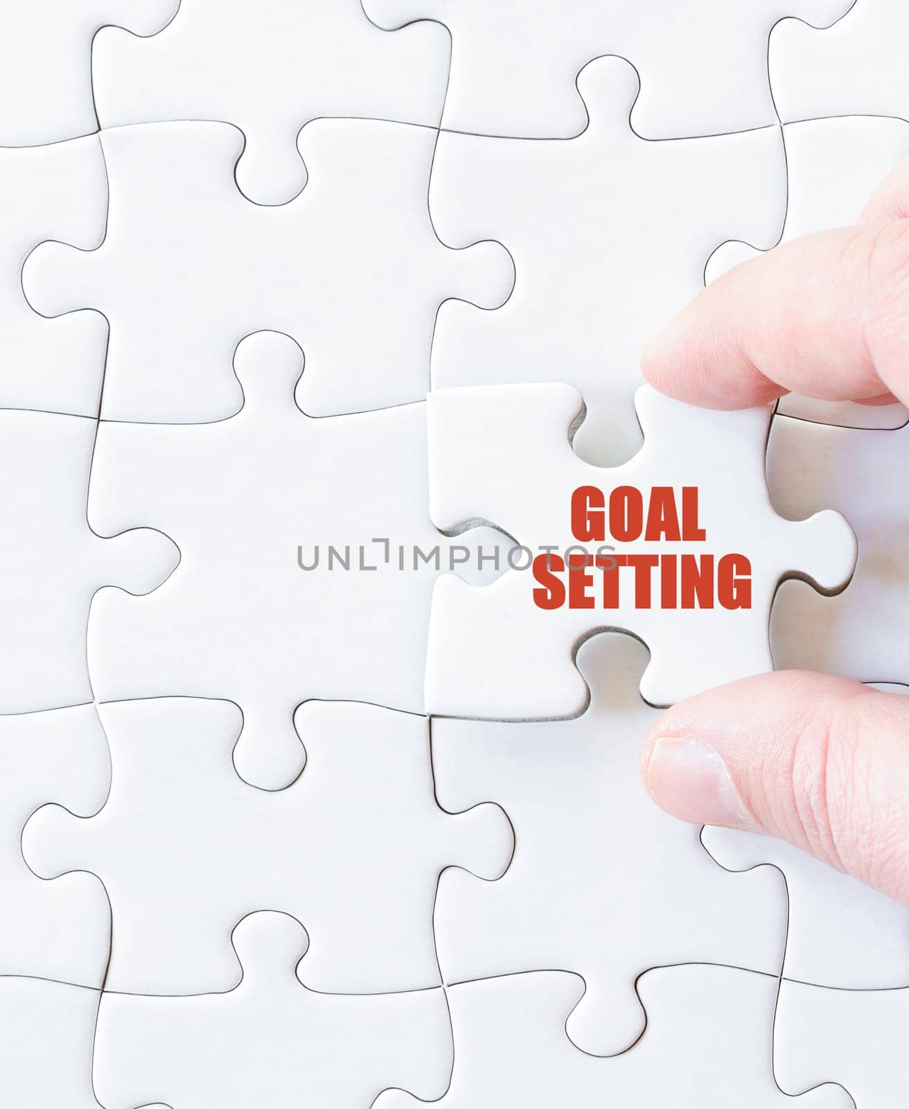 Last puzzle piece with words  GOALS SETTING. Concept image