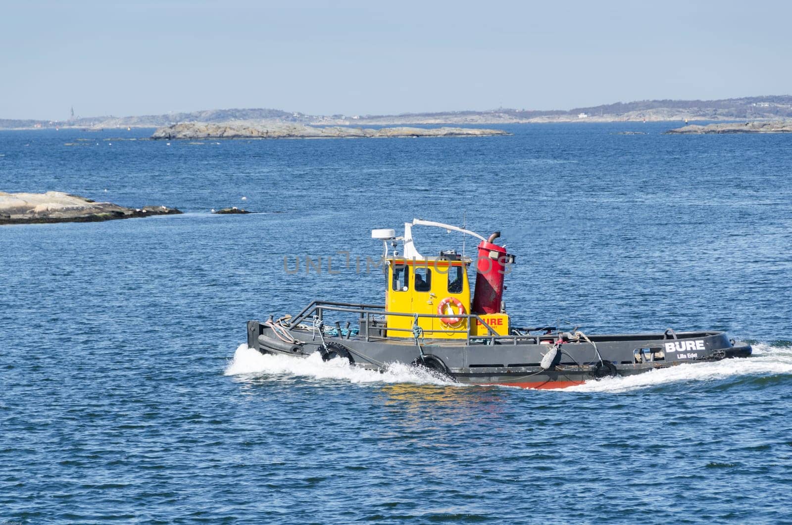 tug boat on the way in water to go to work