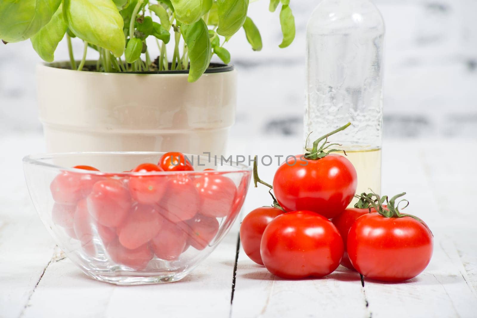 tomatoes and basil on the old white table