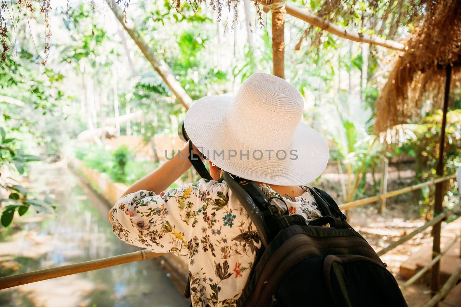 Goa, India. Young Backpacker Tourist Photographed Nature In Sahakar Spice Plantation