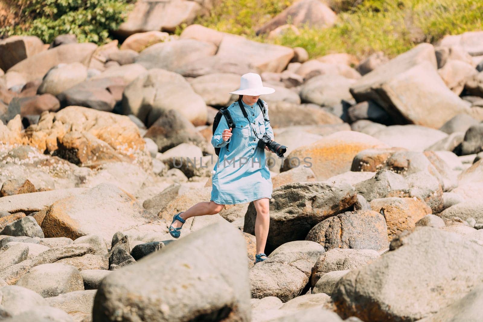 Kanica, Goa, India. People Standing On Pile Of Stones And Taking Photo At Sunny Summer Day.