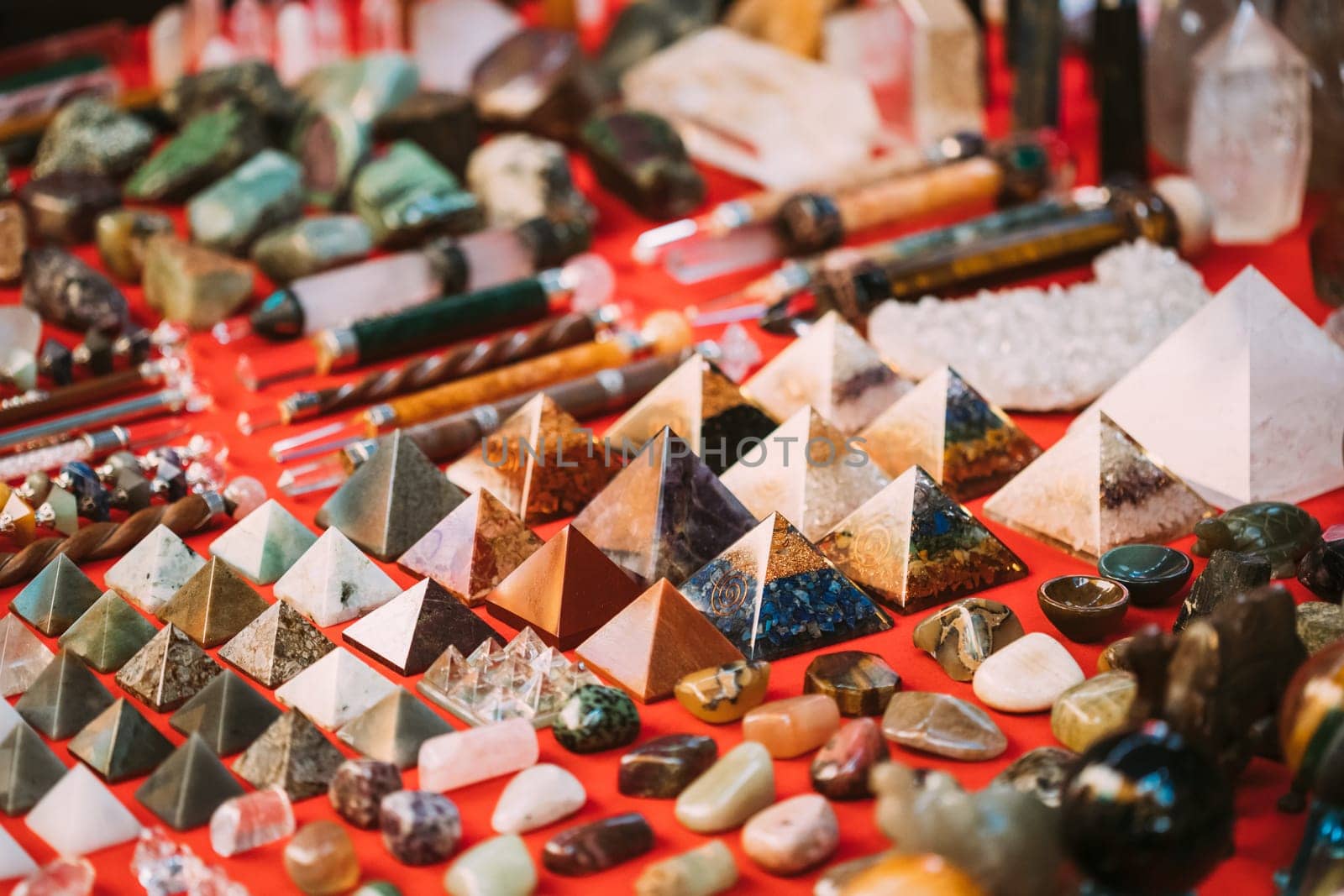 Goa, India. Set Of Indian Chakra Pyramids Made Of Quartz Natural Crystal. Stone Pyramids On Local Goa Market. Popular Souvenirs From India.