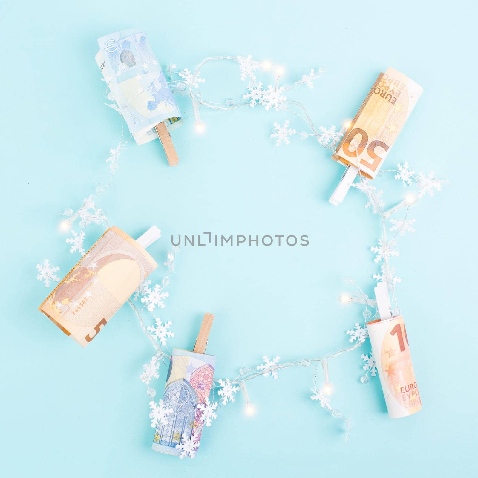 Christmas fairy lights with money, increase of electricity costs, save energy at the holiday season