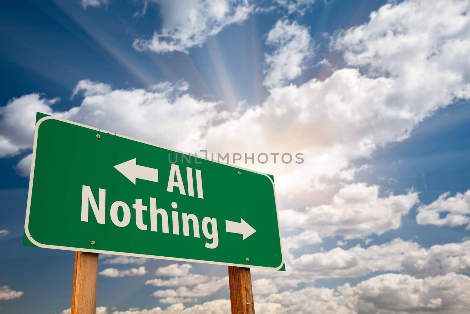 All or Nothing Green Road Sign Over Dramatic Clouds and Sky.