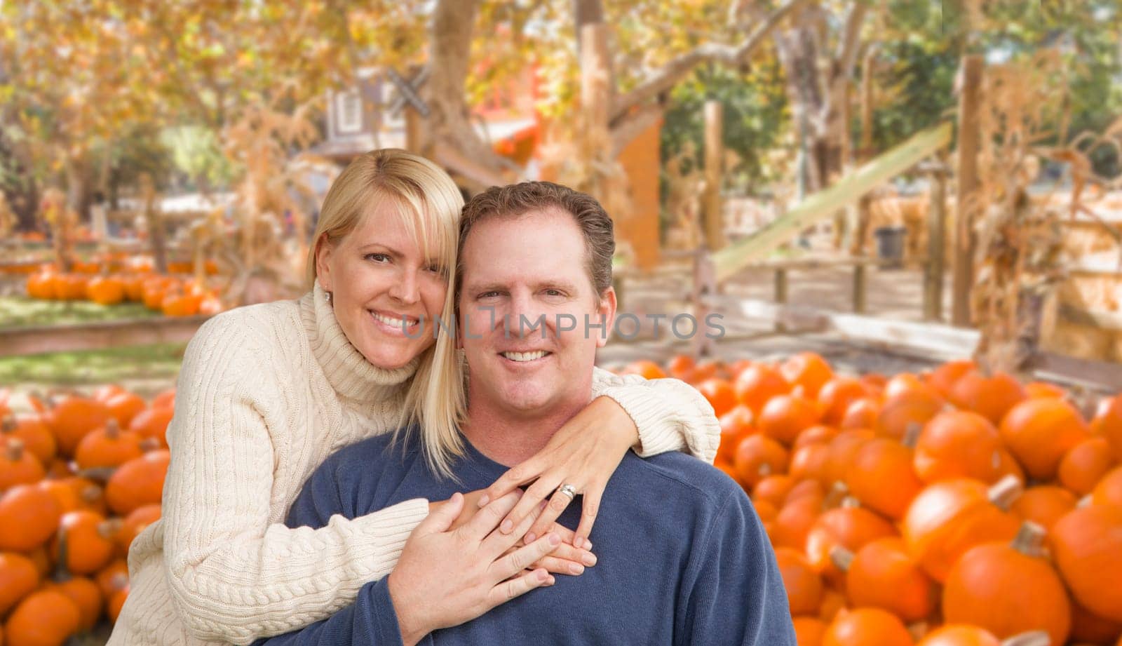 Happy Caucasian Young Adult Couple at the Pumpkin Patch Farm.