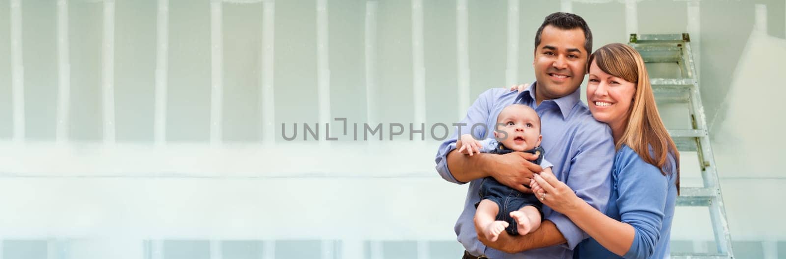 Young Biracial Family Inside Room with New Sheetrock Drywall and Ladder.