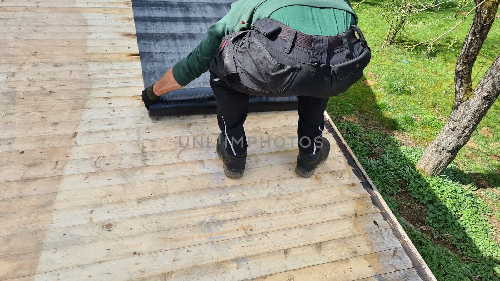 Roofing felt welding on bitumen roof roof repair with roofing felt and open flame propane tool on flat roof, leak with free space for text