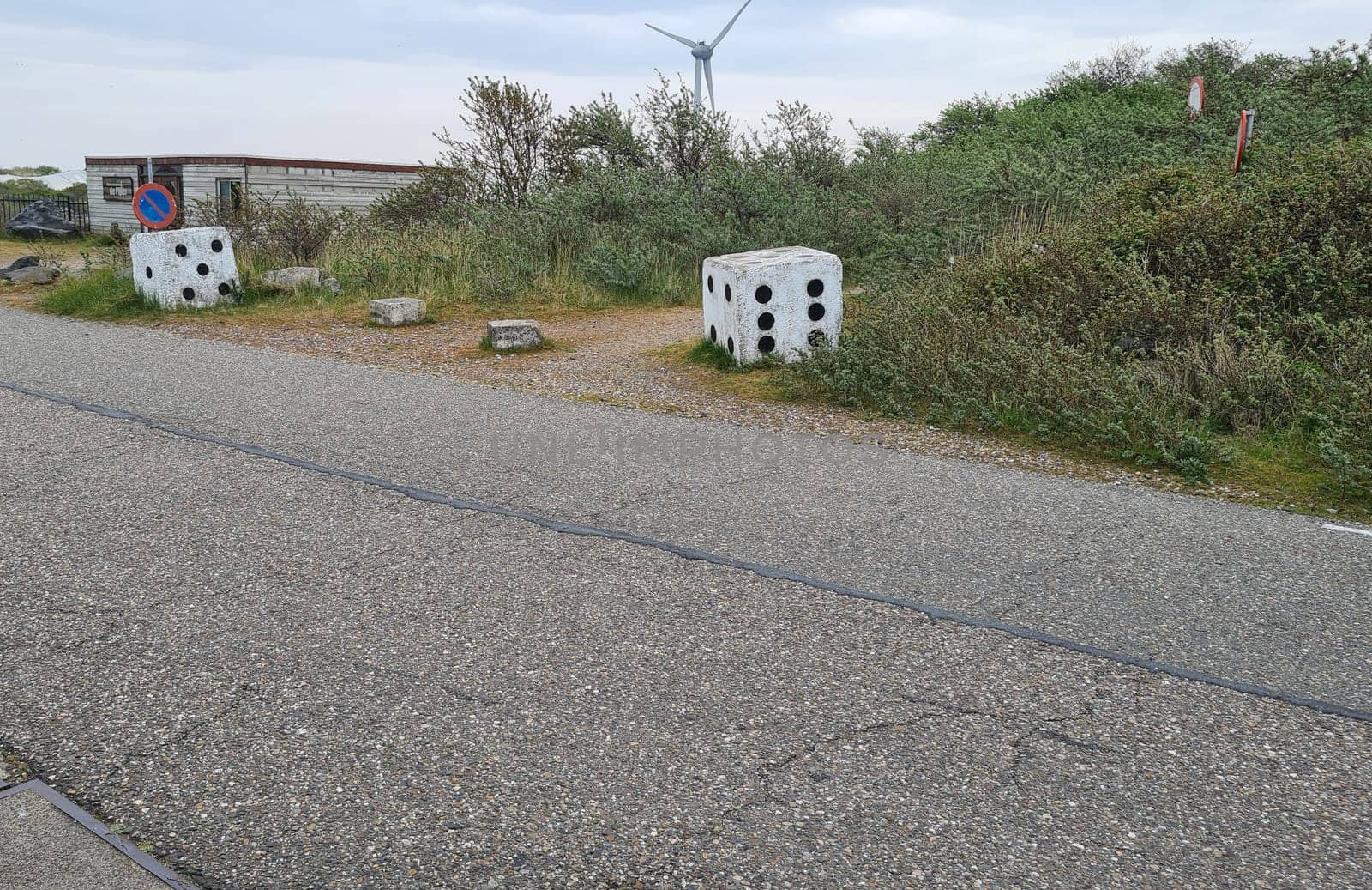 Big white stones, looks like a big white cube with black dots