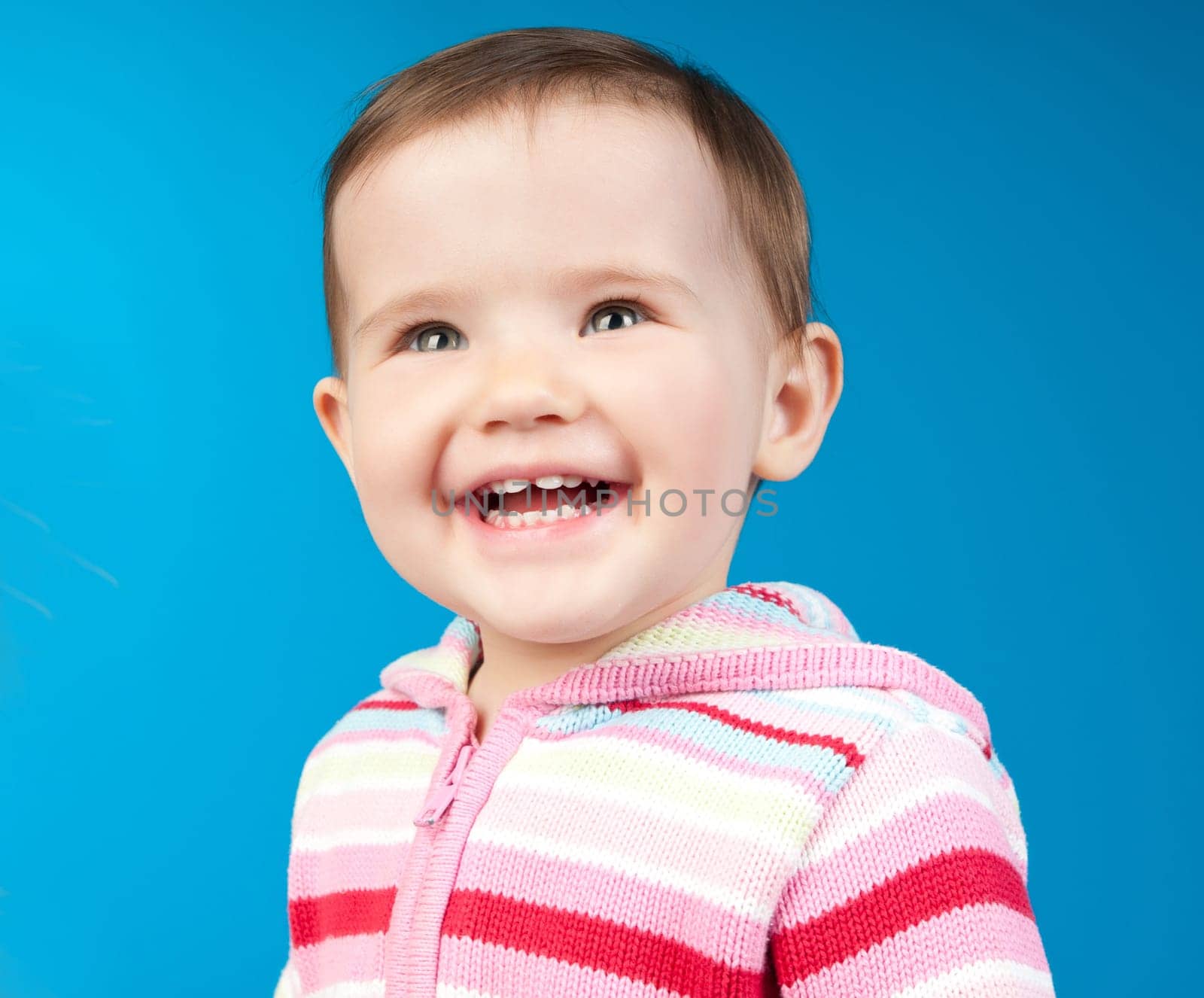 small child isolated on a blue background