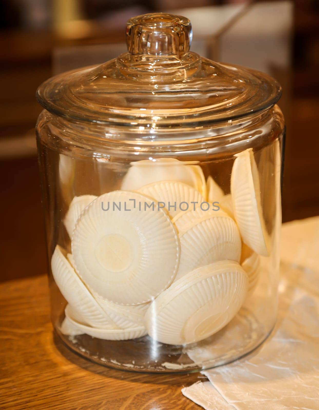 Wafers for ice cream scoops in a glass container. This kind of waffles used to exist in the GDR.
